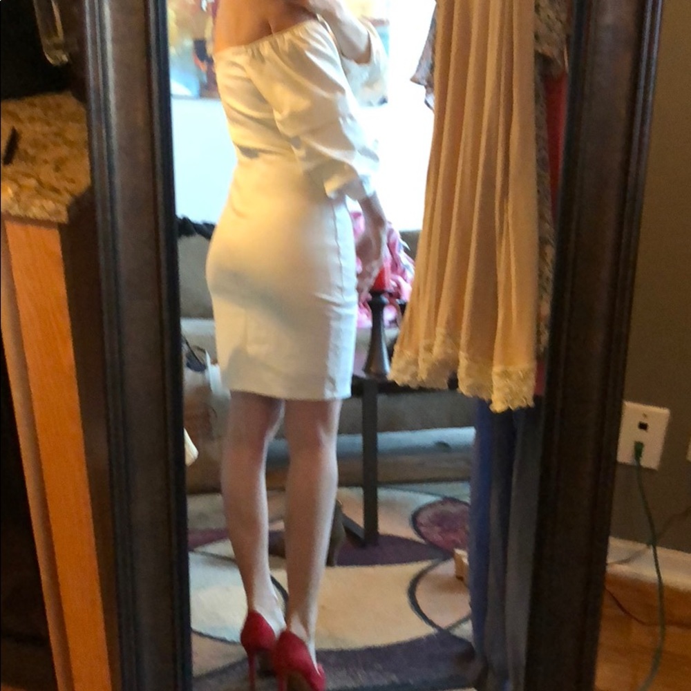 White off the shoulder body con dress.